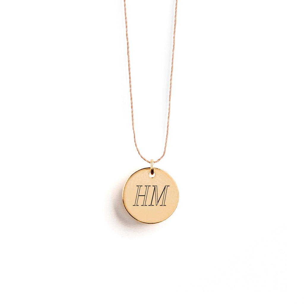 Our best-selling Fine Cord Necklace now available with an engraved 11mm disc for a personalised engraving message. The perfect personalised jewellery gift.