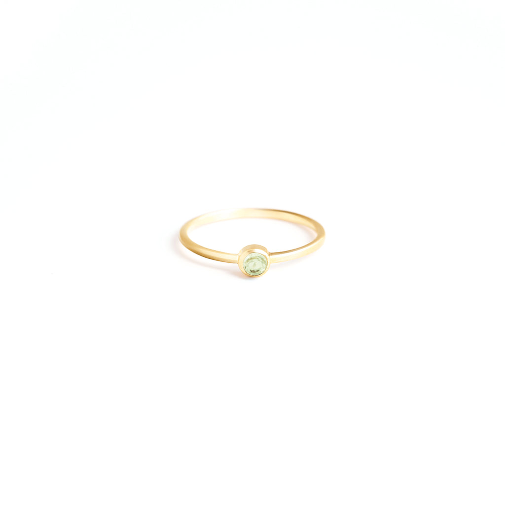 Wanderlust Life Birthstone Jewellery Collection. New August birthstone gold ring with green peridot semi precious gemstone, the perfect gift of jewellery. Wanderlust Life handmade jewellery in the UK.