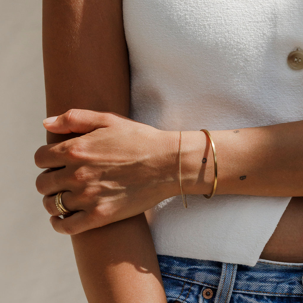 Wanderlust Life Solid Gold Bracelet. Celine curb style chain is the perfect timeless piece to add to your jewellery collection. Minimal, understated and modern jewellery. Designed and handcrafted in our Devon studio.