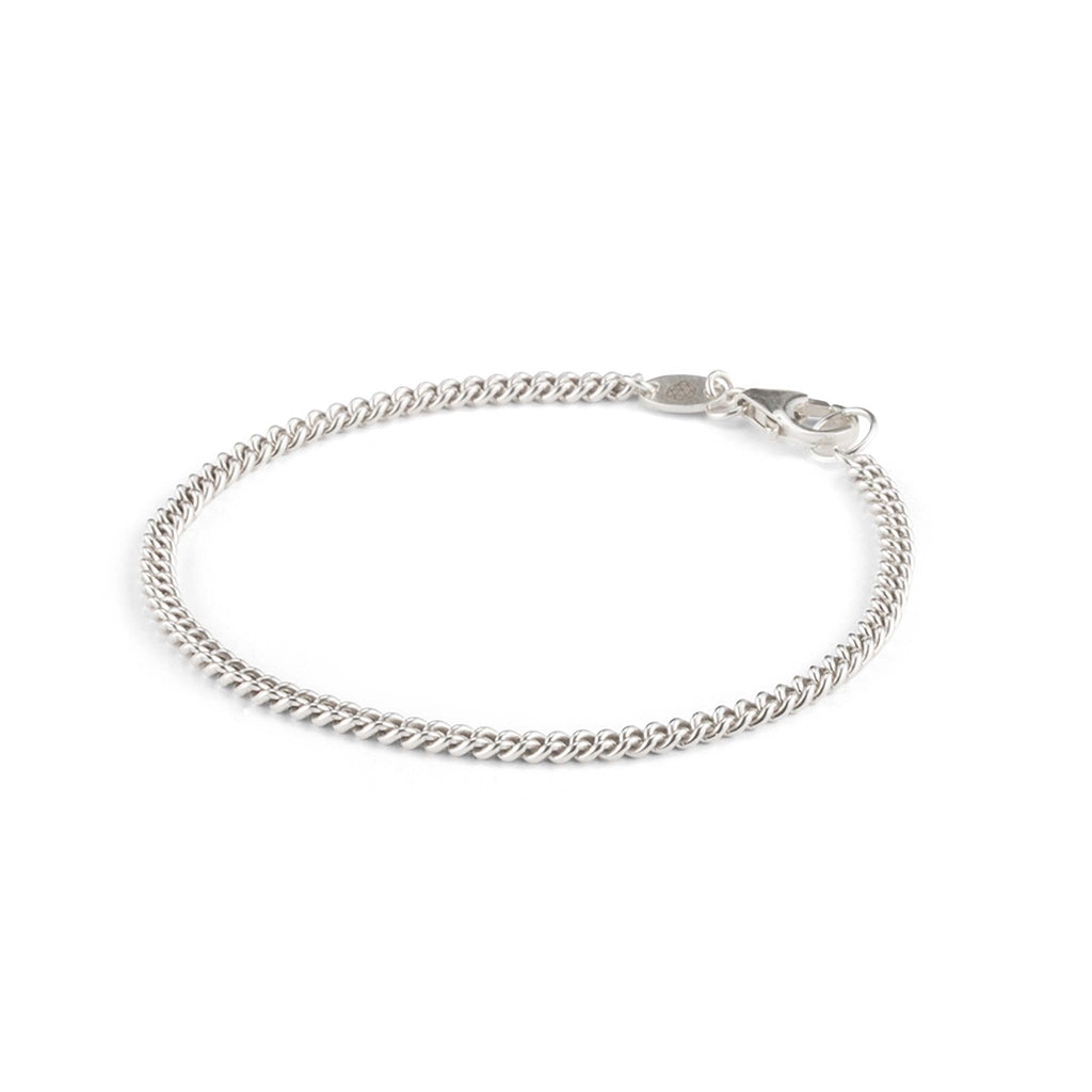 The Charlie Bracelet is a chunky and substantial curb chain, created with recycled sterling silver. Designed in our studio and sustainably handcrafted in the UK.