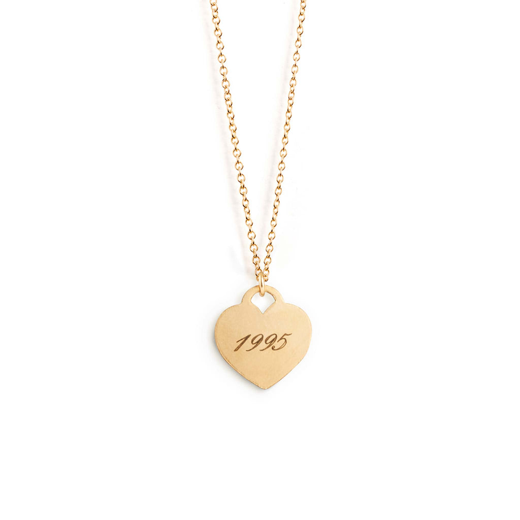 Heart shaped pendant necklace, engraved with the year 1995 in modern script - an italic but modern font. Shop engravable Love Notes.