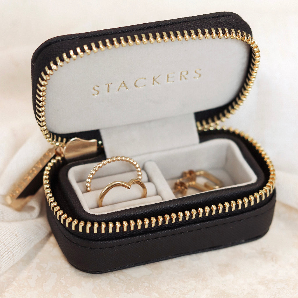 Featuring a secure gold zip, a travel jewellery box perfect for storing rings.