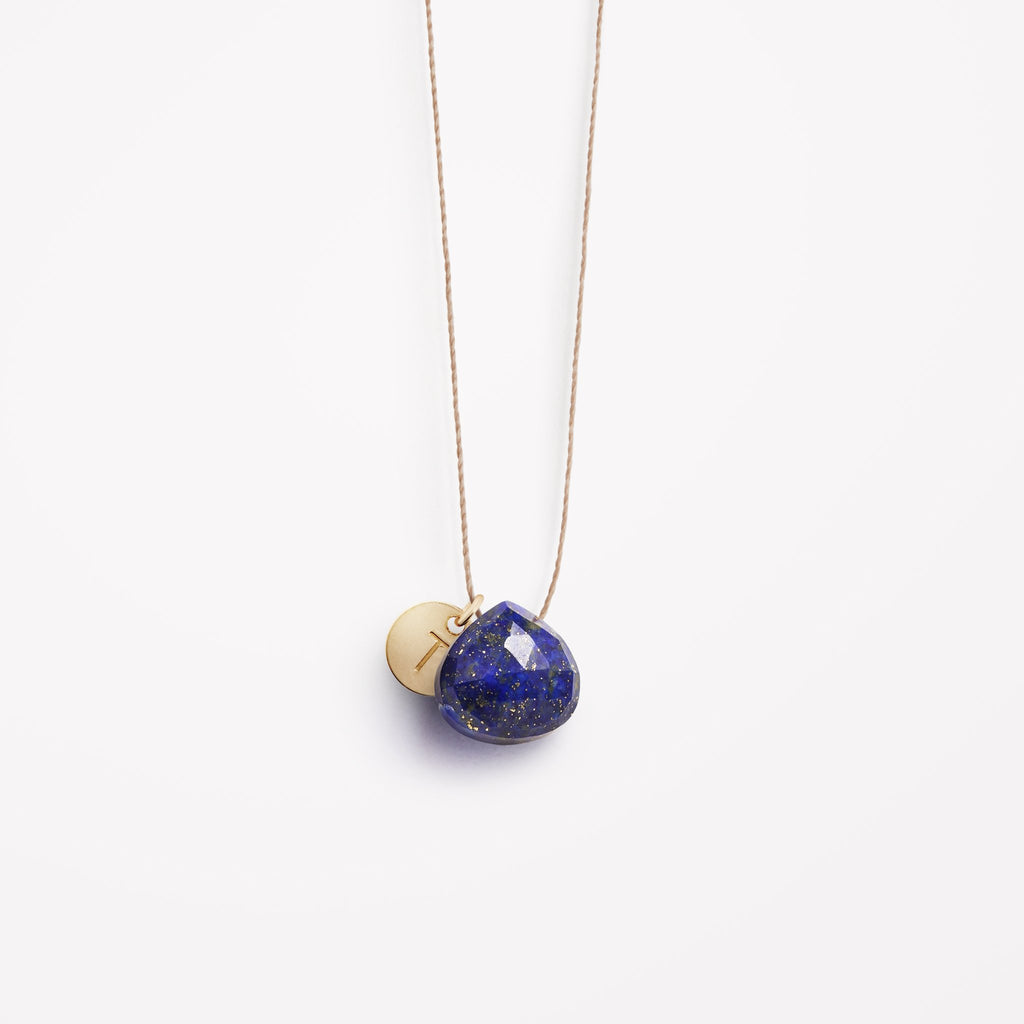 A Lapis Lazuli gemstone necklace is personalised initial tag. The Lapis Lazuli gemstone is distinctive with it's deep blue, navy colour and gold flecks that sparkle across its surface.