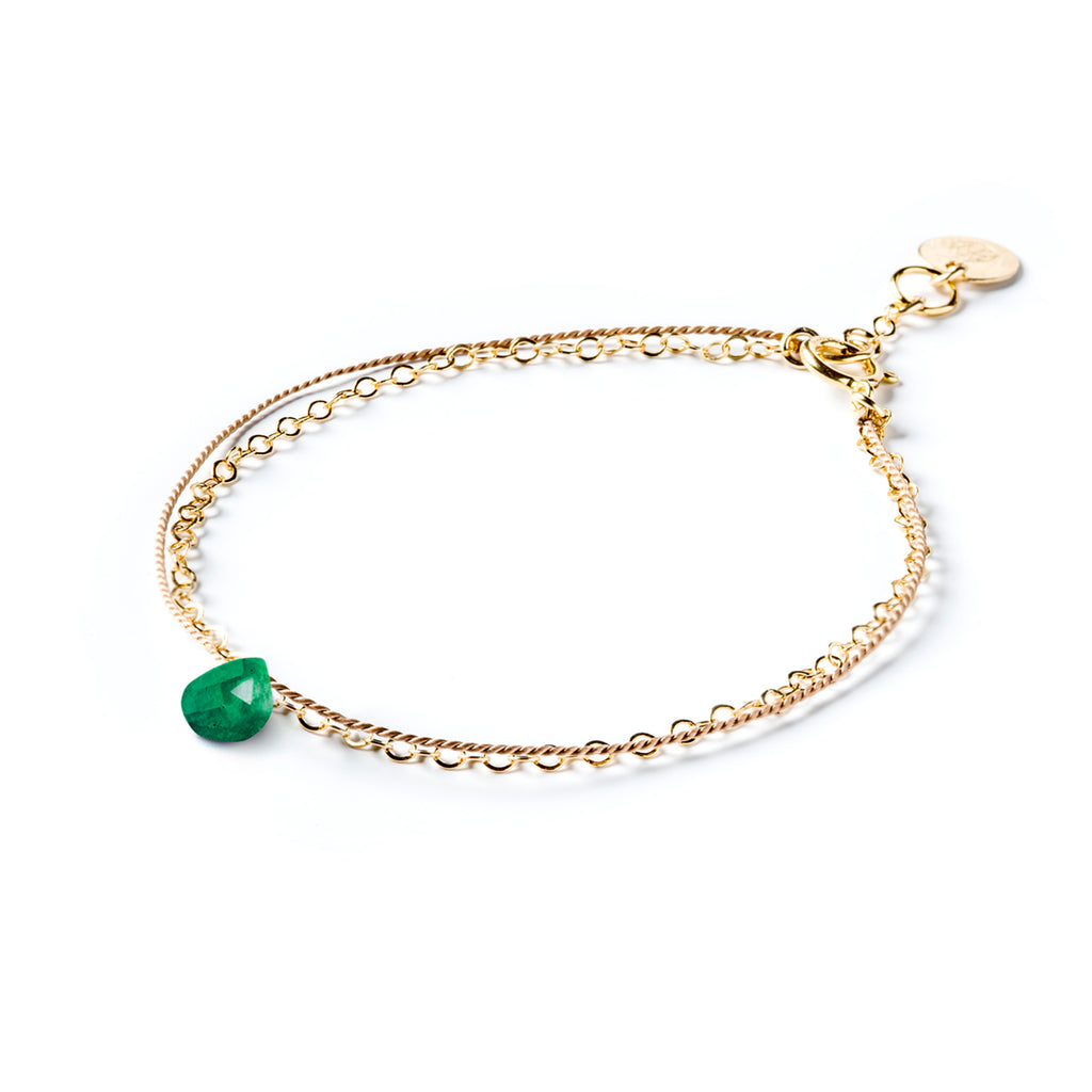 May Birthstone Gold and Silk Bracelet with green emerald gemstone. Creating the illusion of two bracelets layered into a stack, this gemstone bracelet combines a layer of a silk and a layer of gold fill chain. Wanderlust Life’s signature aesthetic of minimal, modern and meaningful jewellery. Shop affordable birthstone jewellery online, perfect for birthday gifts. 