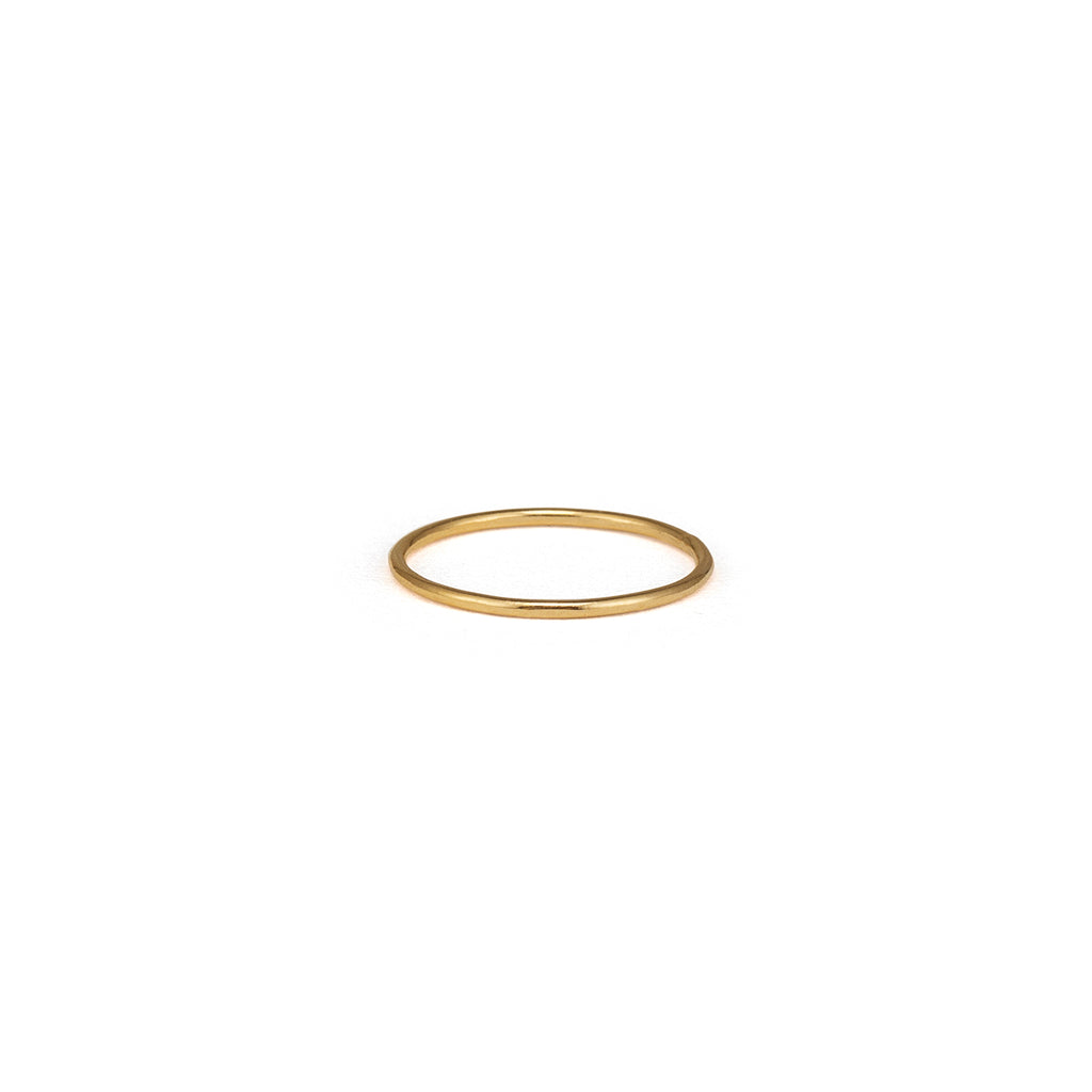 This slim and minimal band ring in 14k gold fill features a hammered finish.