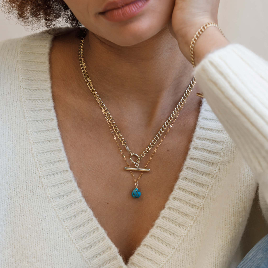 Mohave Turquoise gemstone pendant necklace worn at 19inches, styled with the Morgan double curb t-bar necklace.