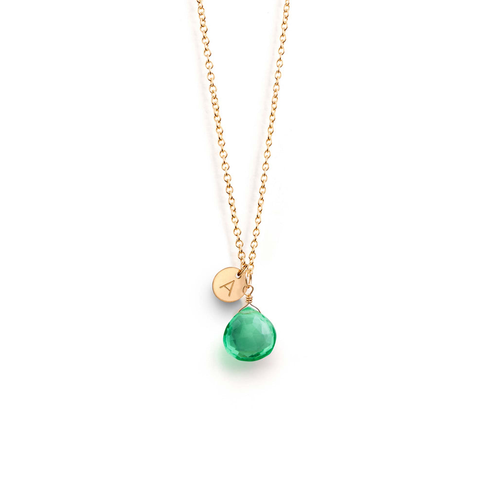 A Seafoam Green Quartz Gemstone pendant hangs on a minimal gold-fill chain. Personalised with an A initial charm. Handcrafted, designed and personalised in our Devon studio.