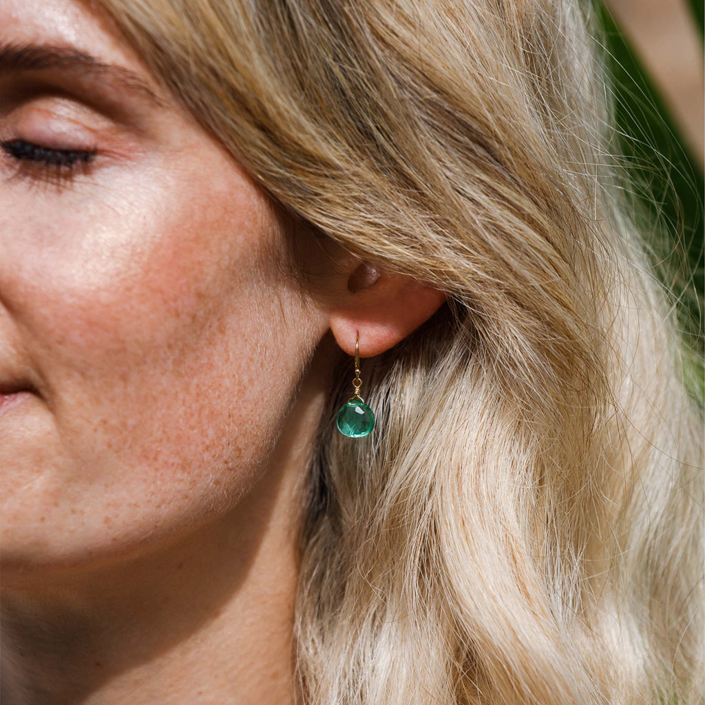 Our signature Isla drop earrings featuring a translucent sea foam green gemstones, dangling from minimal gold fill ear wires.