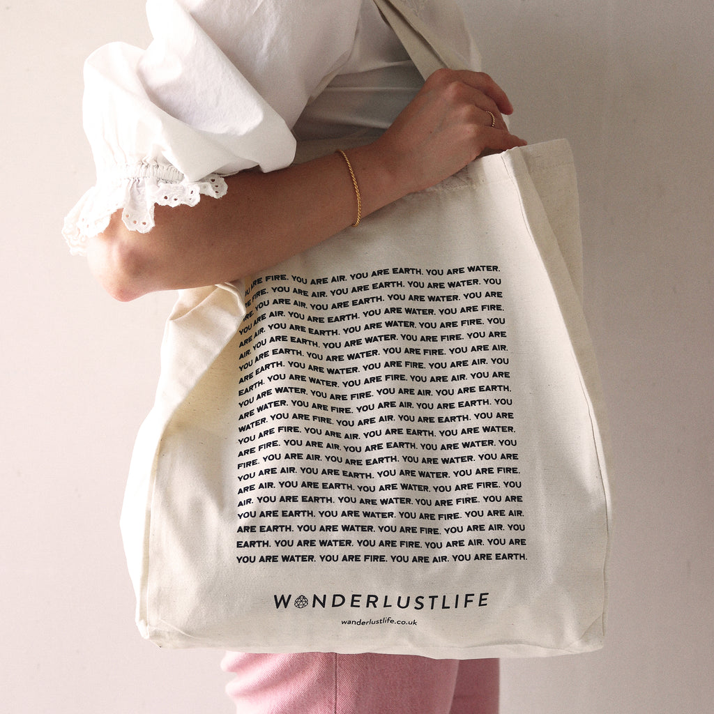 Wanderlust Life Sustainable Elemental Tote, made with recycled sustainable materials. Designed to represent our Elemental Collection, illustrated by Clara Jonas. Shop the Elemental collection online at Wanderlust Life.