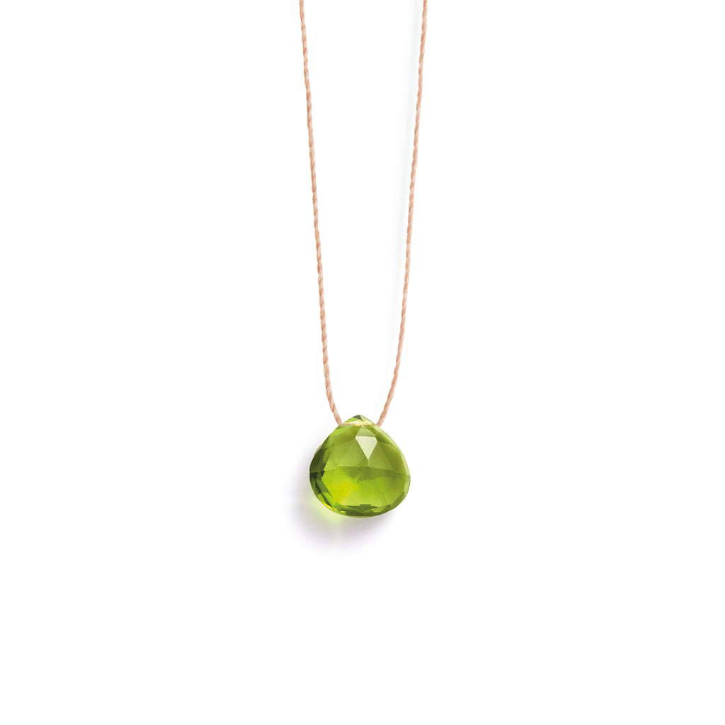 From Wanderlust Life Jewellery's birthstone collection - a minimal peridot fine cord necklace. A green gemstone in Wanderlust Life's faceted signature shape.The perfect gift for August birthdays. Designed and handmade in Devon, UK.