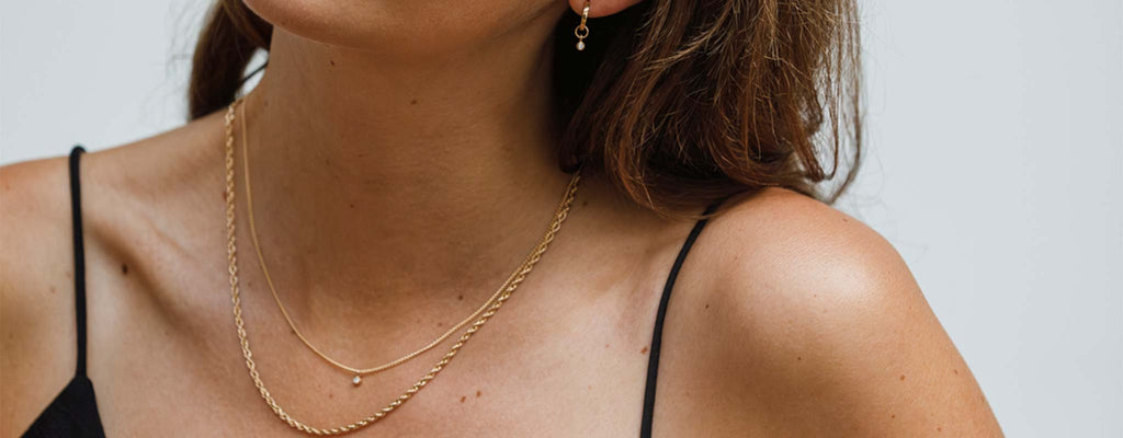 Solid Gold Jewellery designed by Wanderlust Life. Shop 9k yellow gold necklaces, earrings and bracelets online.