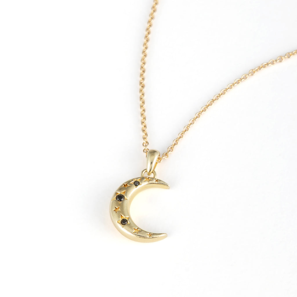 This limited-edition crescent pendant is studded with three black diamond stars set on a shorter chain for a 90s-inspired silhouette