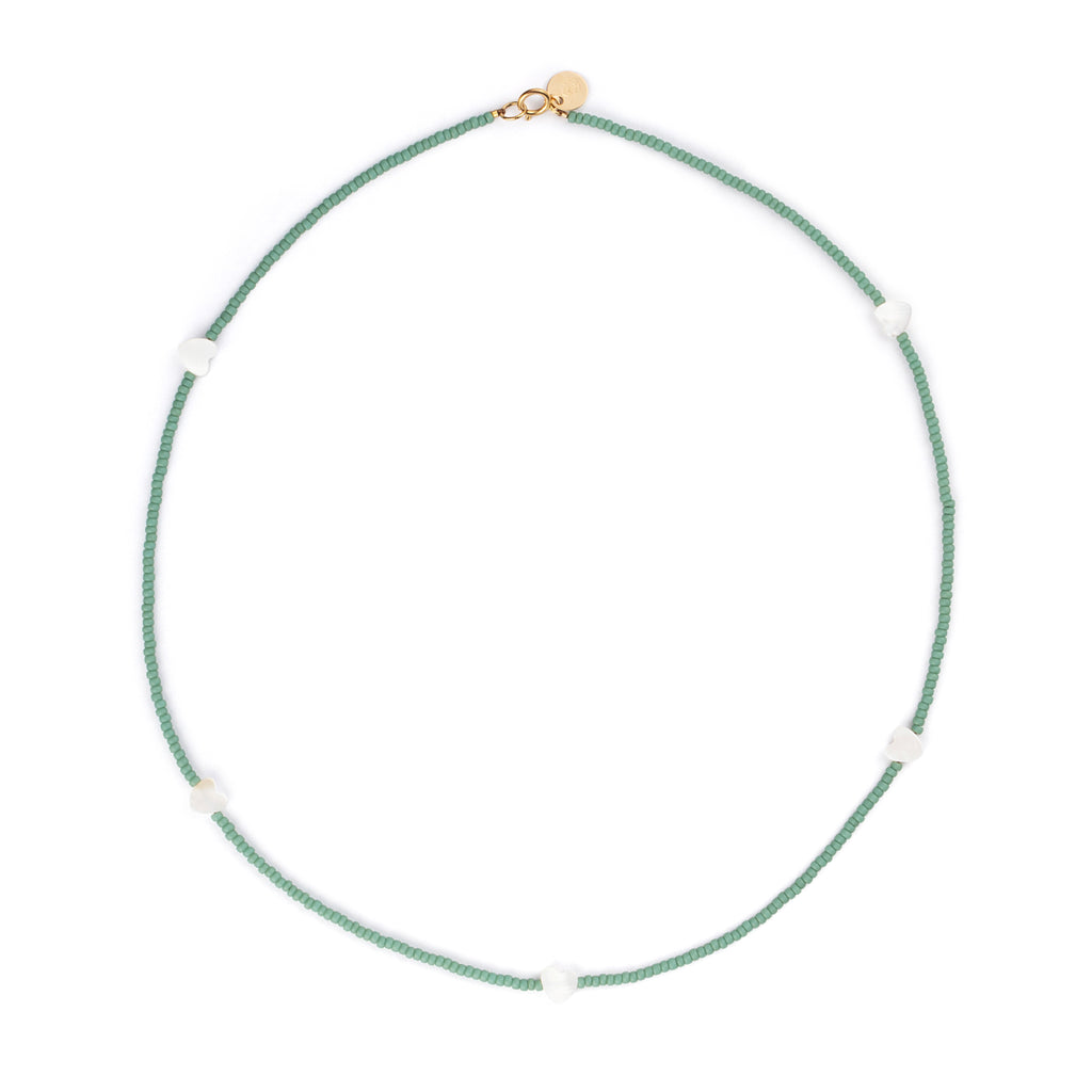 Featuring seed beads in cloudy sky blue, our beaded necklace is interspersed with mother of pearl heart charms, designed to layer, love, and wear on repeat.