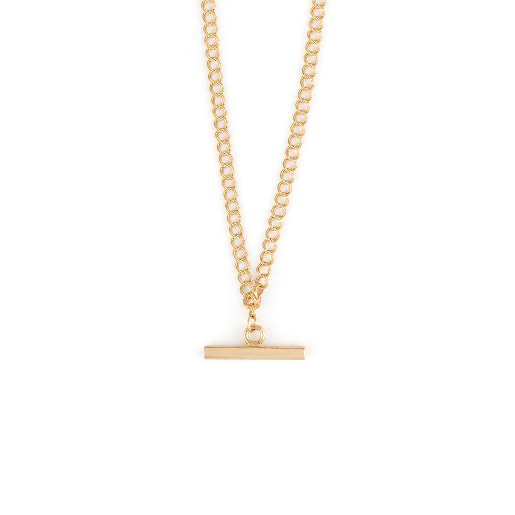 A sleek double curb chain is finished with the T-bar toggle detail as a pendant.