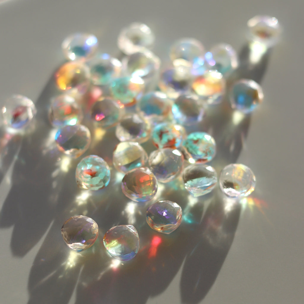 Rainbow Quartz Gemstones feature a spectrum of colours with rainbow iridescence.