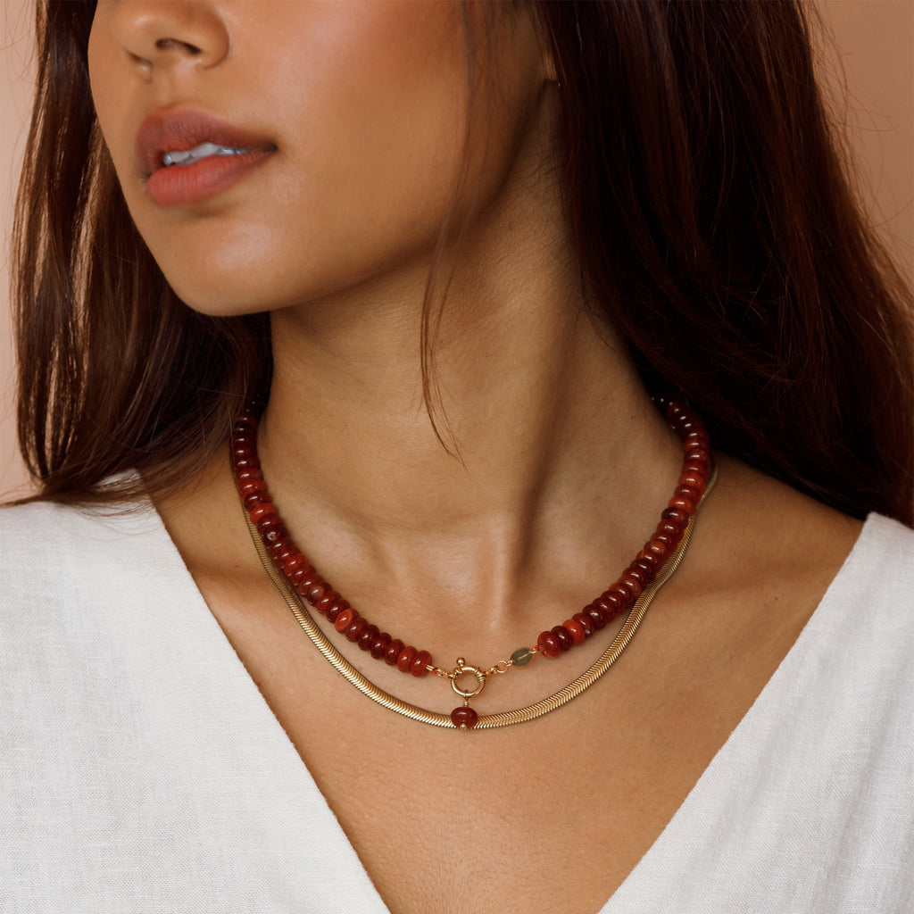 Chunky Red Agate doughnut beaded necklace layered with paseo necklace.