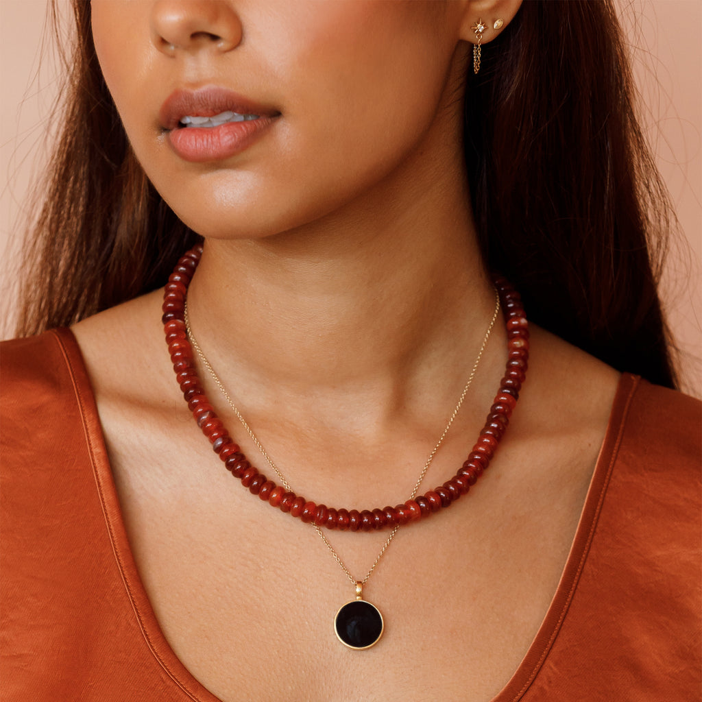 Red Agate Beaded Necklace layered with Black Onyx Porthole Necklace.