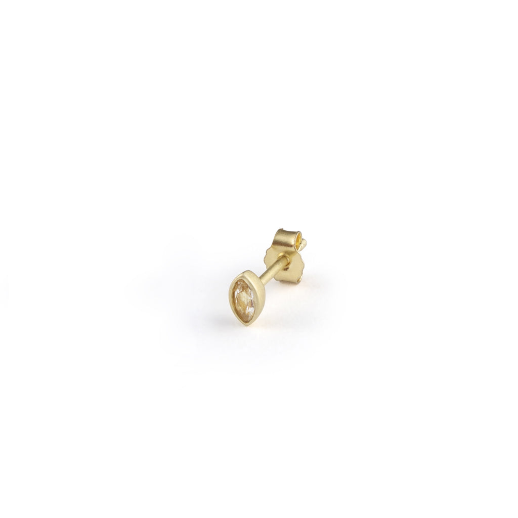 A delicate elliptical bezel setting surrounds a shimmering White Topaz on a stud earring.