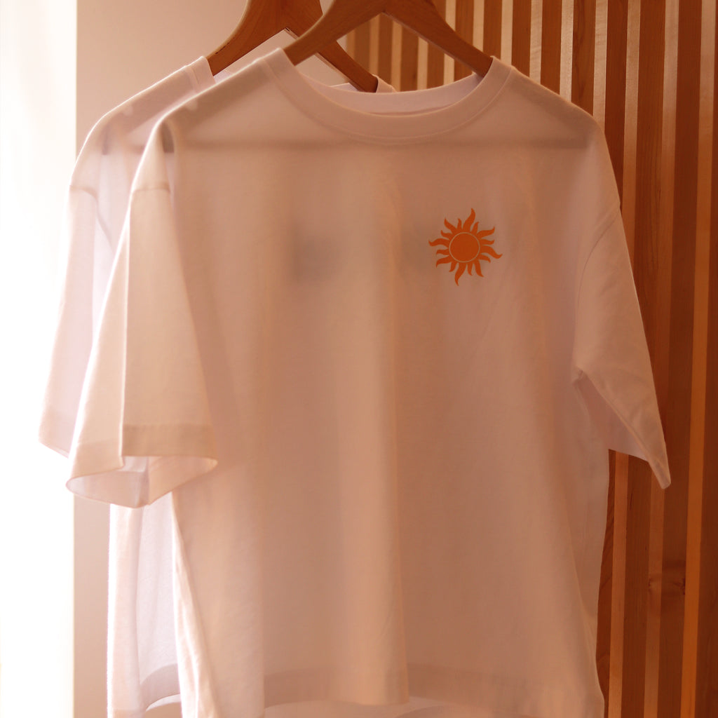 Cut for a relaxed fit and made from organic cotton, our Sunshine Statement t-shirt features a vibrant sun screen printed on the front and le soleil on the back.