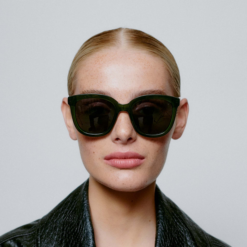 A sophisticated and oversized style with large lenses and green toned frames. UV400 protective sunglasses by A.Kjaerbede.