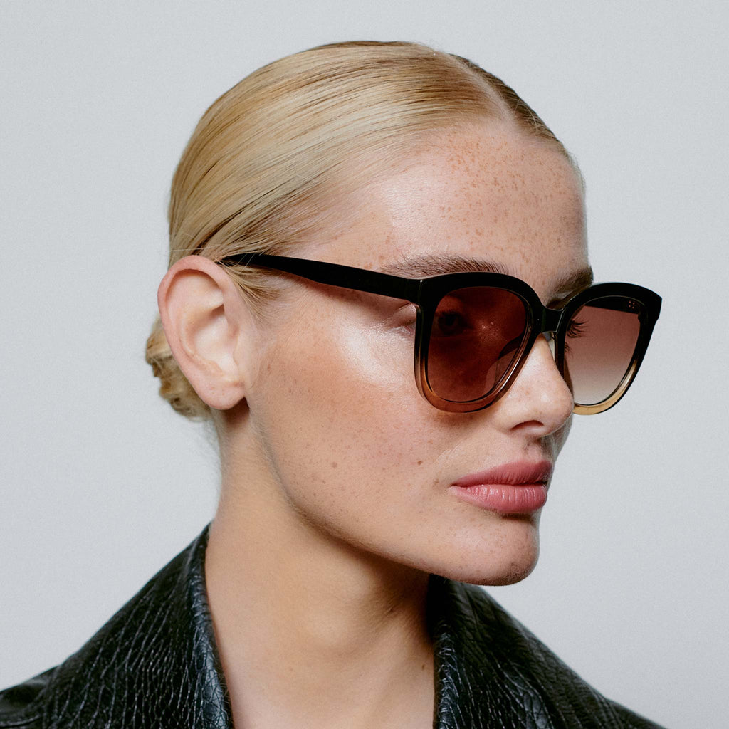 The side view of the Billy Sunglasses with black and brown dual tone frames and oversized lenses.