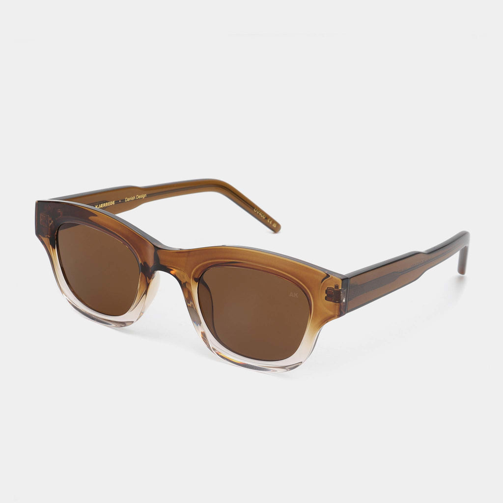 Two tone linear frames with smokey brown lenses. Designed by A.Kjaerbede, available at Wanderlust Life.