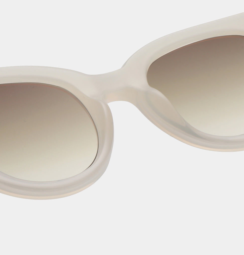 Lilly is a modern yet minimal take on a classic shape and style, featuring cream frames.