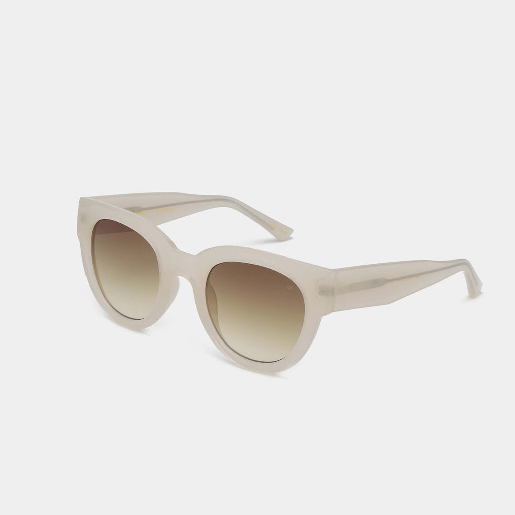 Bold cream sunglasses in a rounded cat eye style. 