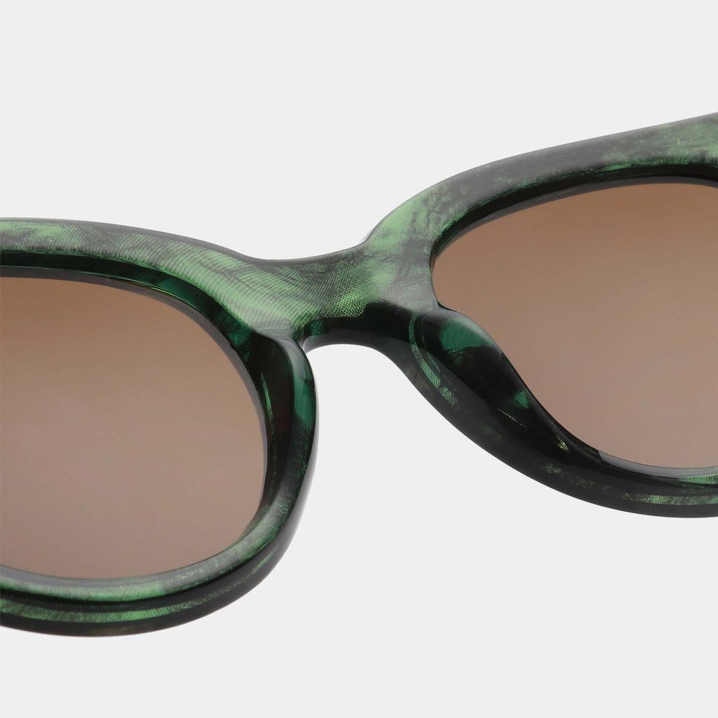 Lilly is an extravagant take on a classic shape and style, featuring frames with a green marble pattern.