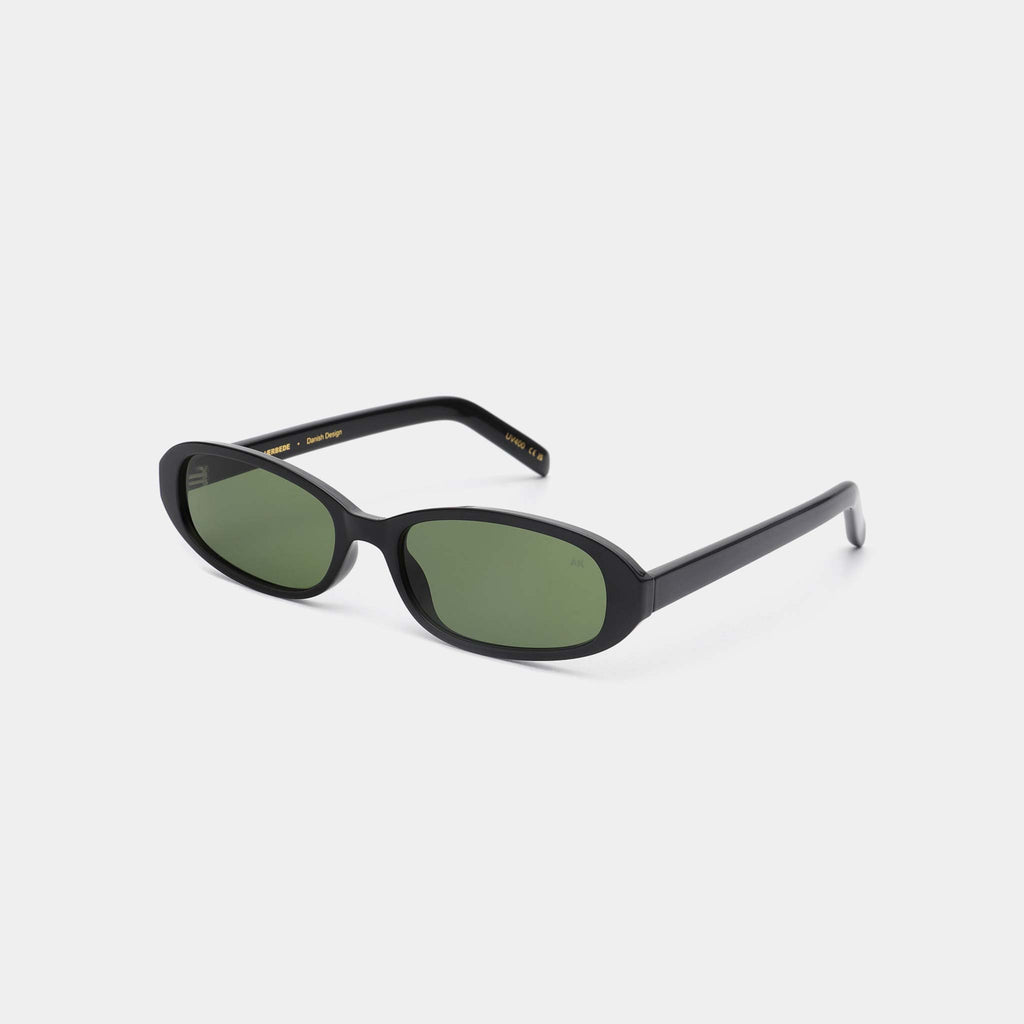 Black sunglasses with green lenses on a white background