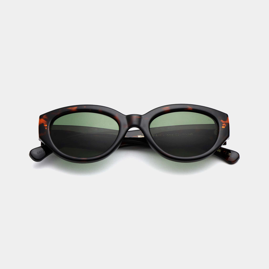 Modern cat eye sunglasses with brown tortoise frames and green lenses.
