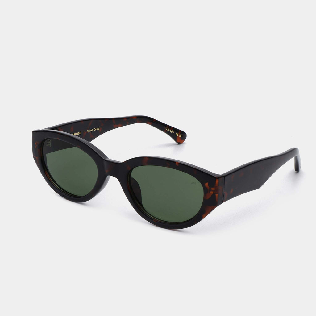 Cat eye sunglasses with a green lens and substantial tortoise frames, designed by A.Kjaerbede.