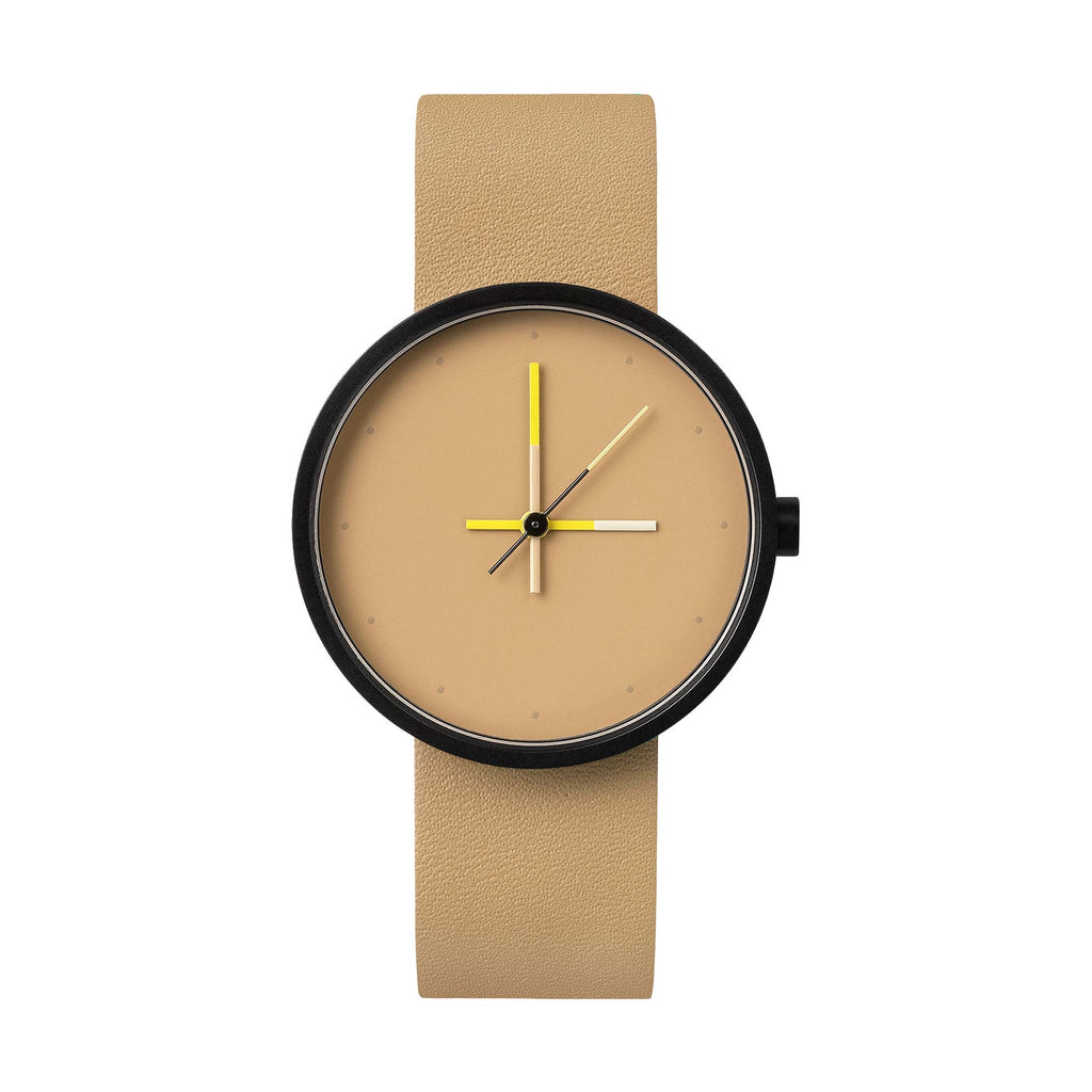 A watch featuring a black stainless steel case, a neutral beige face and strap, with watch hands in vivid yellow to accent the muted tones.