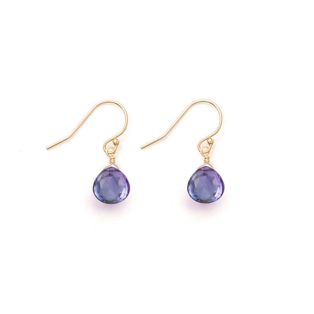 Alexandrite Quartz Gemstones hang from minimal gold-fill ear wires. These drop earrings feature Alexandrite Quartz in our signature, faceted shape. Alexandrite Quartz is a colour changing gemstone, in some lights looking purple and others appearing blue.