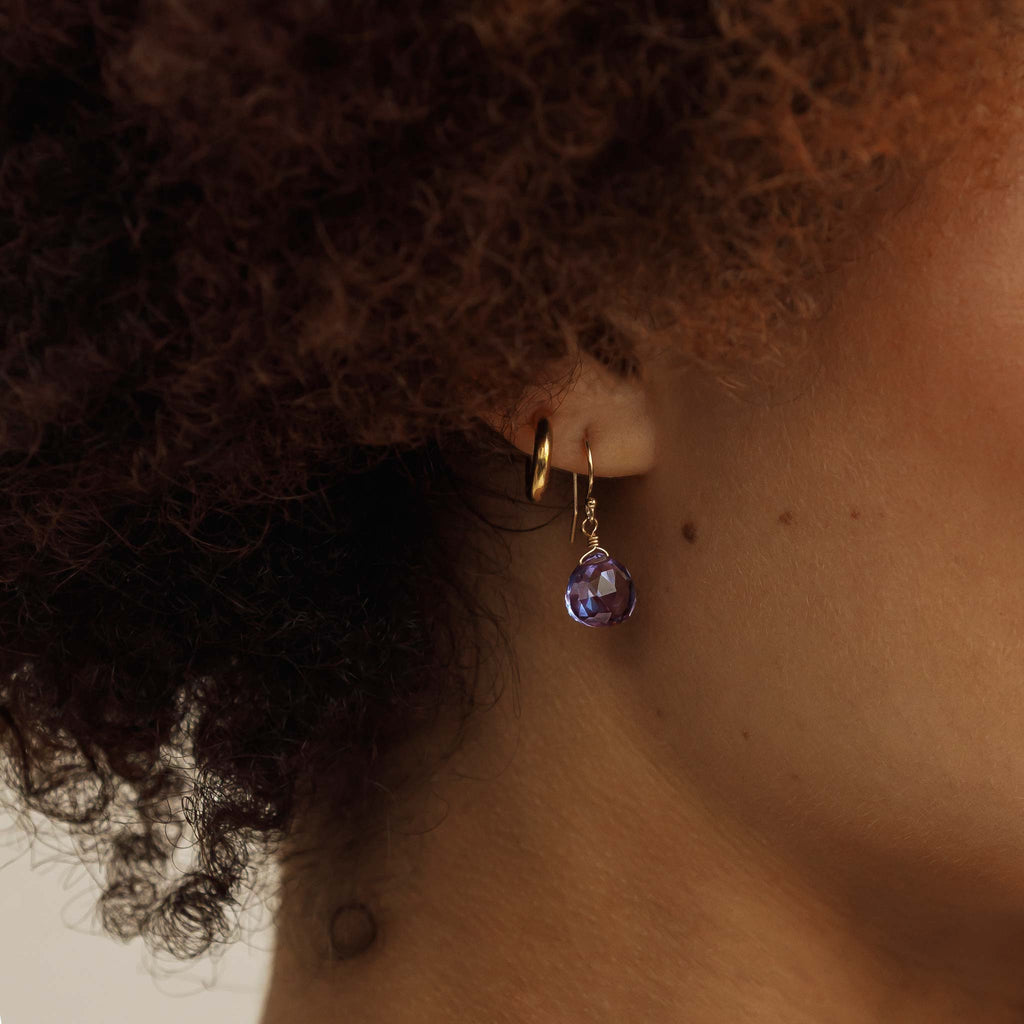 An Alexandrite Quartz isla drop earring styled with a minimal gold silke hoops earring.