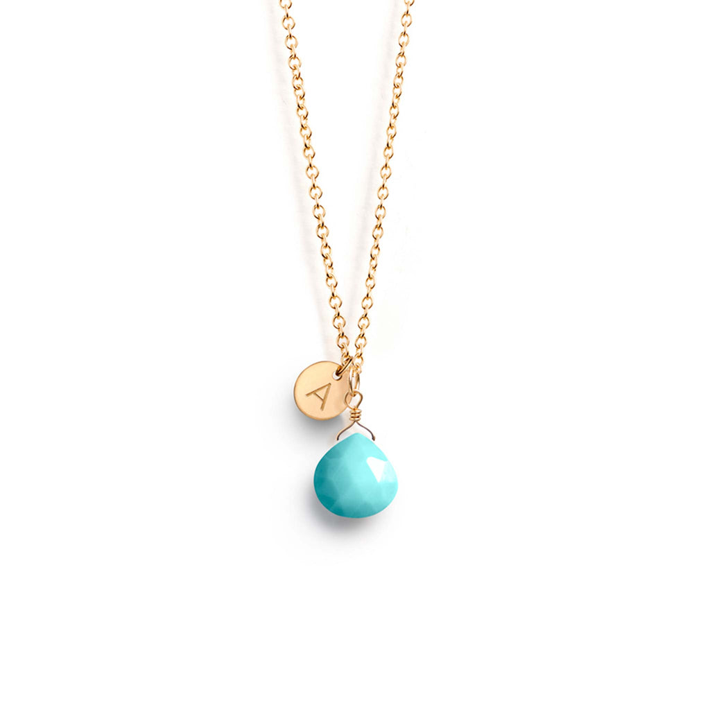 An Arizona Turquoise gemstone necklace is personalised with a hand-stamped monogram initial tag. With a choice of 26 letters, create a personalised piece of jewellery.