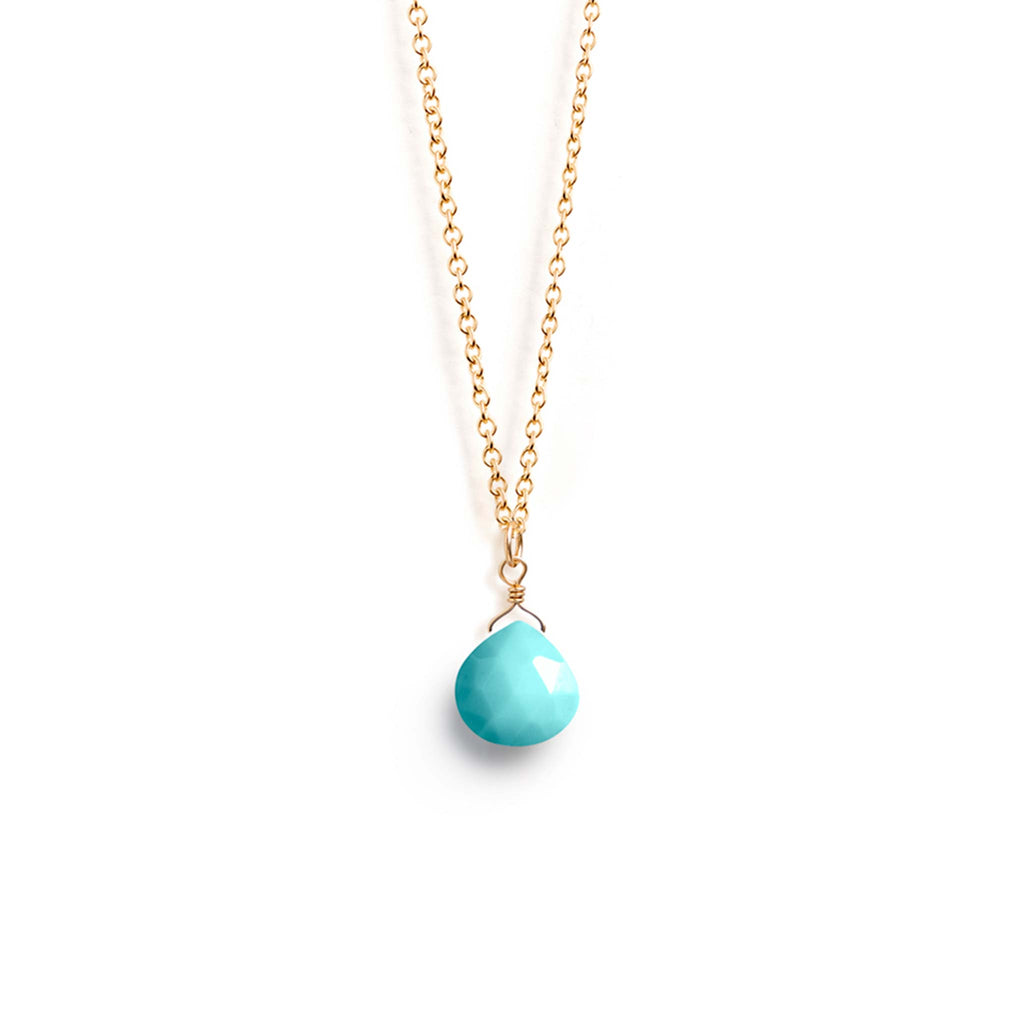 An Arizona Turquoise Gemstone is wire wrapped and suspended on a fine gold chain necklace. The chain is adjustable 17-19 inches and made with 14k gold fill. Handcrafted meaningful jewellery, designed by Wanderlust Life.