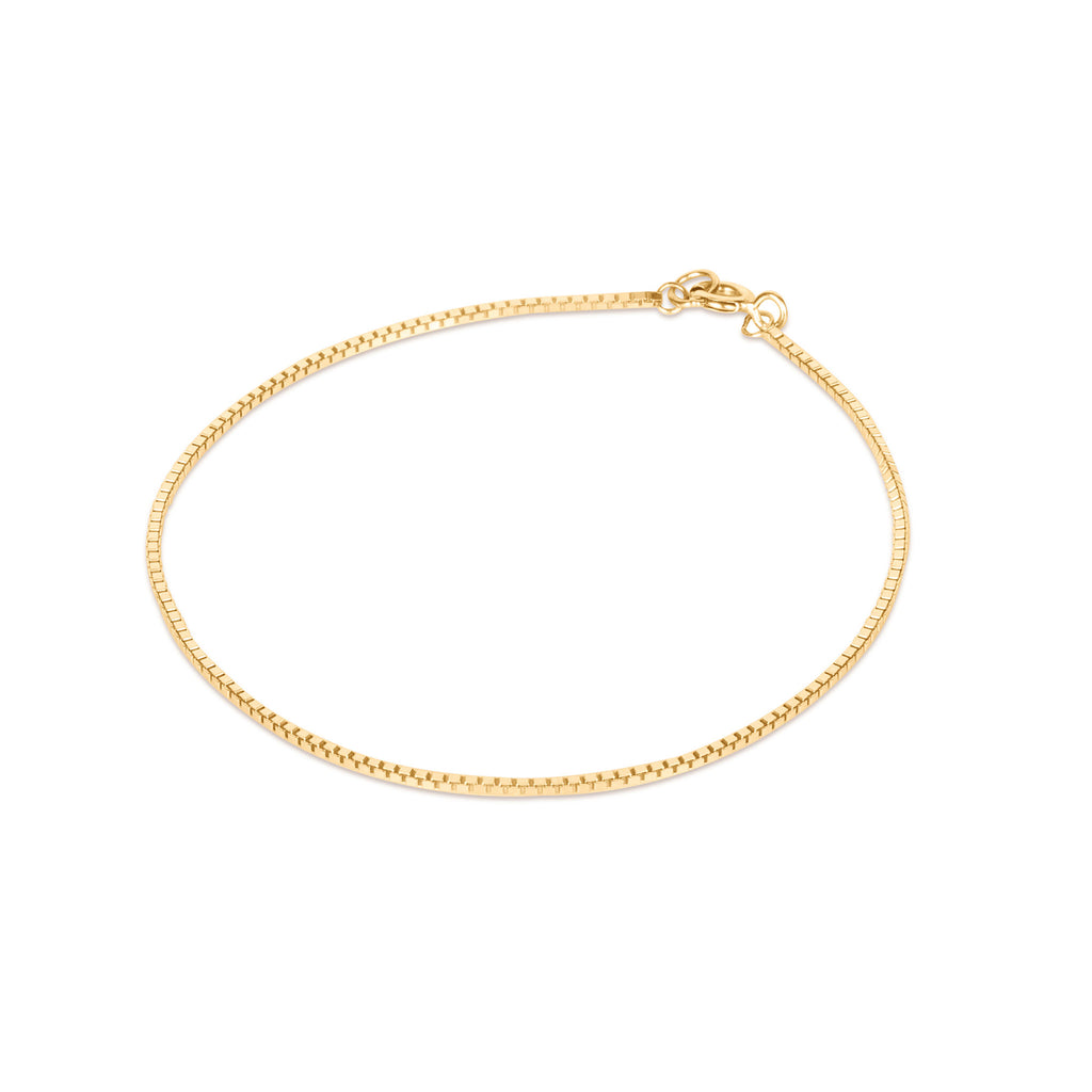 Wanderlust Life Ava Box Chain Bracelet 9k gold. square box links create this minimal chain bracelet, with a shiny, sparkling finish. Designed and handcrafted in the UK. Timeless, minimal gold jewellery.