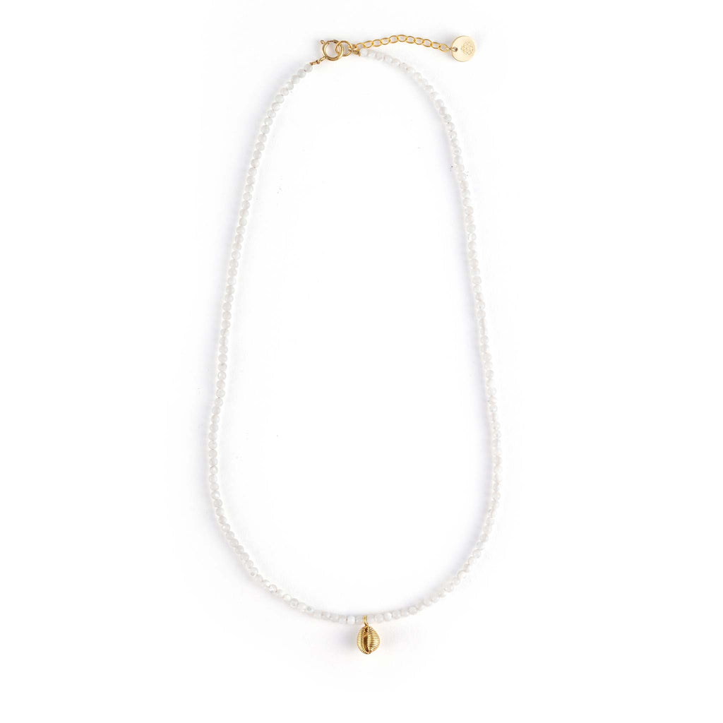 A dainty hand-cast cowry shell dances on a mother of pearl beaded choker necklace.