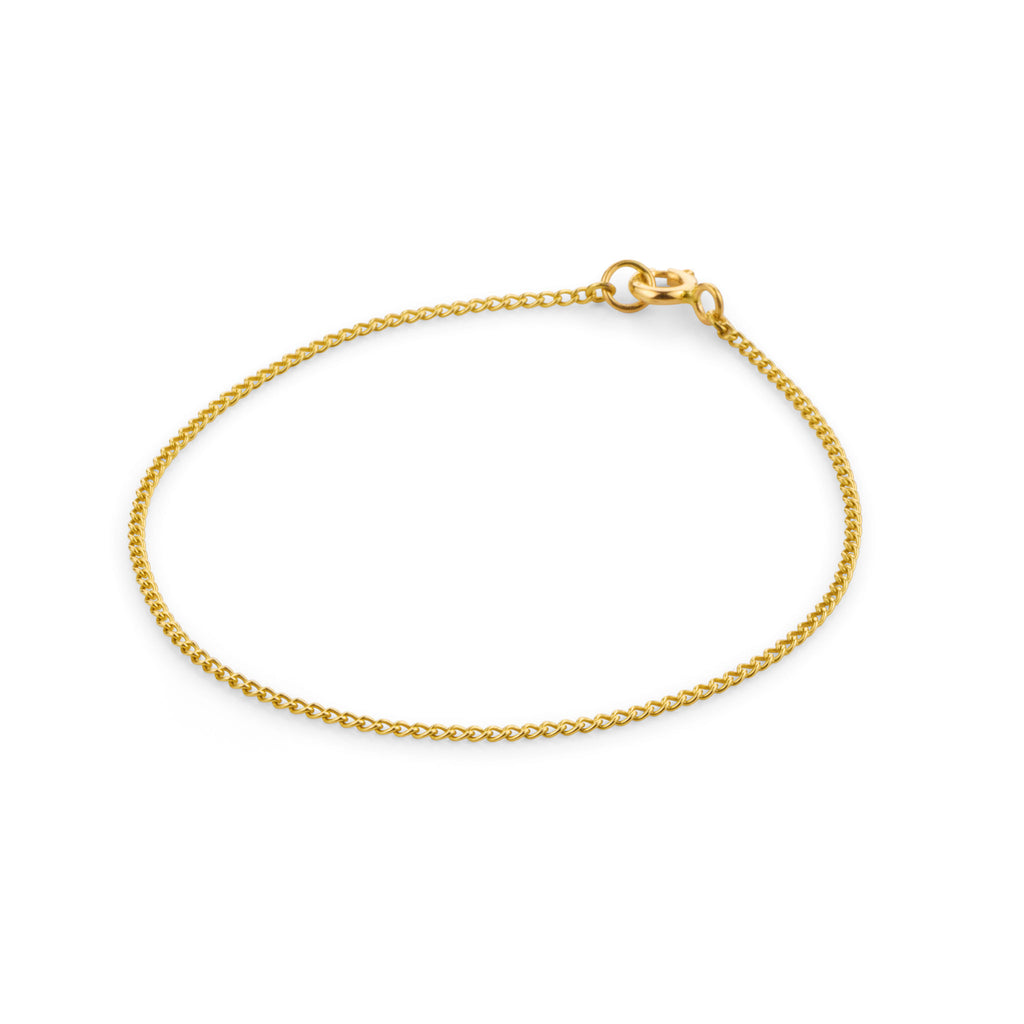 Wanderlust Life Solid Gold Bracelet. Celine curb style chain is the perfect timeless piece to add to your jewellery collection. Minimal, understated and modern jewellery. Designed and handcrafted in our Devon studio.