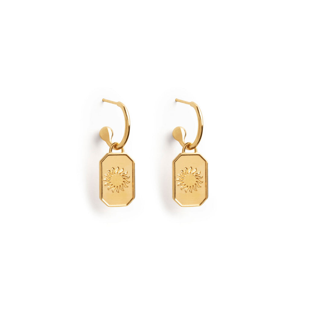 Wanderlust Life Ignis Drop Hoop Earrings. New in the Elemental Collection, gold hoop earrings adorned with a stylised sun. An octagonal hand-cast charm. Proudly designed in Devon, and handcrafted in the UK by our Wanderlust Life global artisan partners.