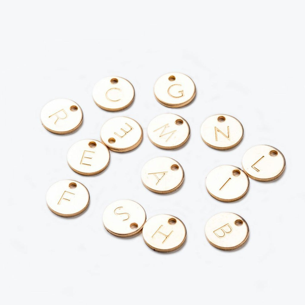 circular 14k gold fill charms, hand-stamped with individual initials. Choose your initial to personalise your jewellery with a monogram charm.