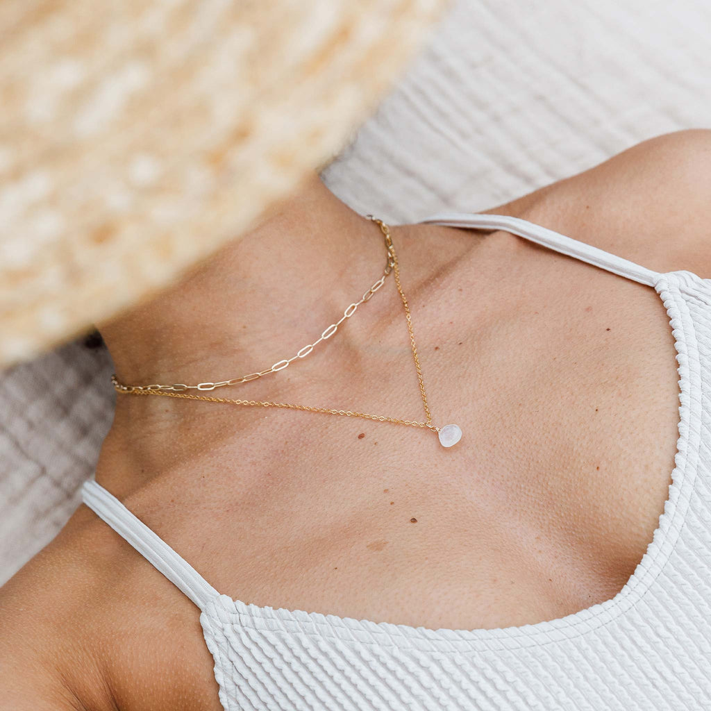 Our modern paperclip chain adds edge to a necklace stack. Styled as a choker length layering chain with a Rainbow Moonstone Pendant Necklace.