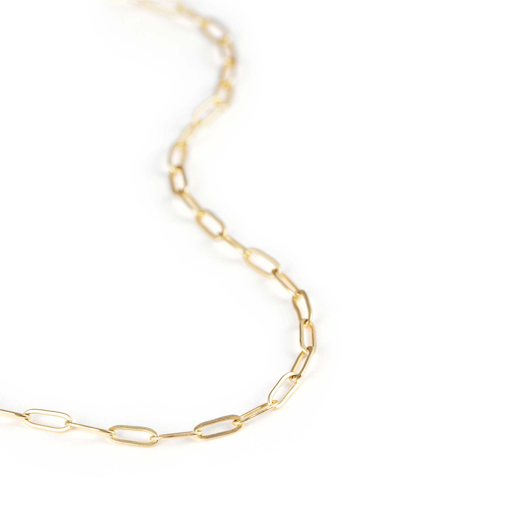 Our modern paperclip chain adds edge to a necklace stack. Handcrafted with 14k gold fill for a lasting gold finish. An adjustable layering necklace to wear between 15 and 17 inches.