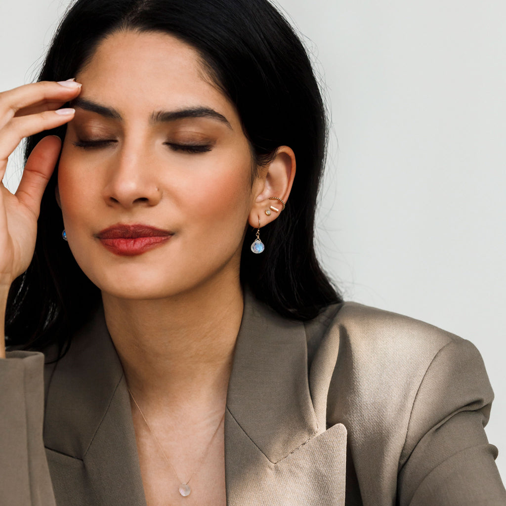 Wanderlust Life Isla drop earring. Rainbow Moonstone Isla drop earring. Drop earrings featuring semi precious rainbow moonstone gemstones. Proudly designed in Devon & handcrafted by our Wanderlust Life jewellery makers in the UK