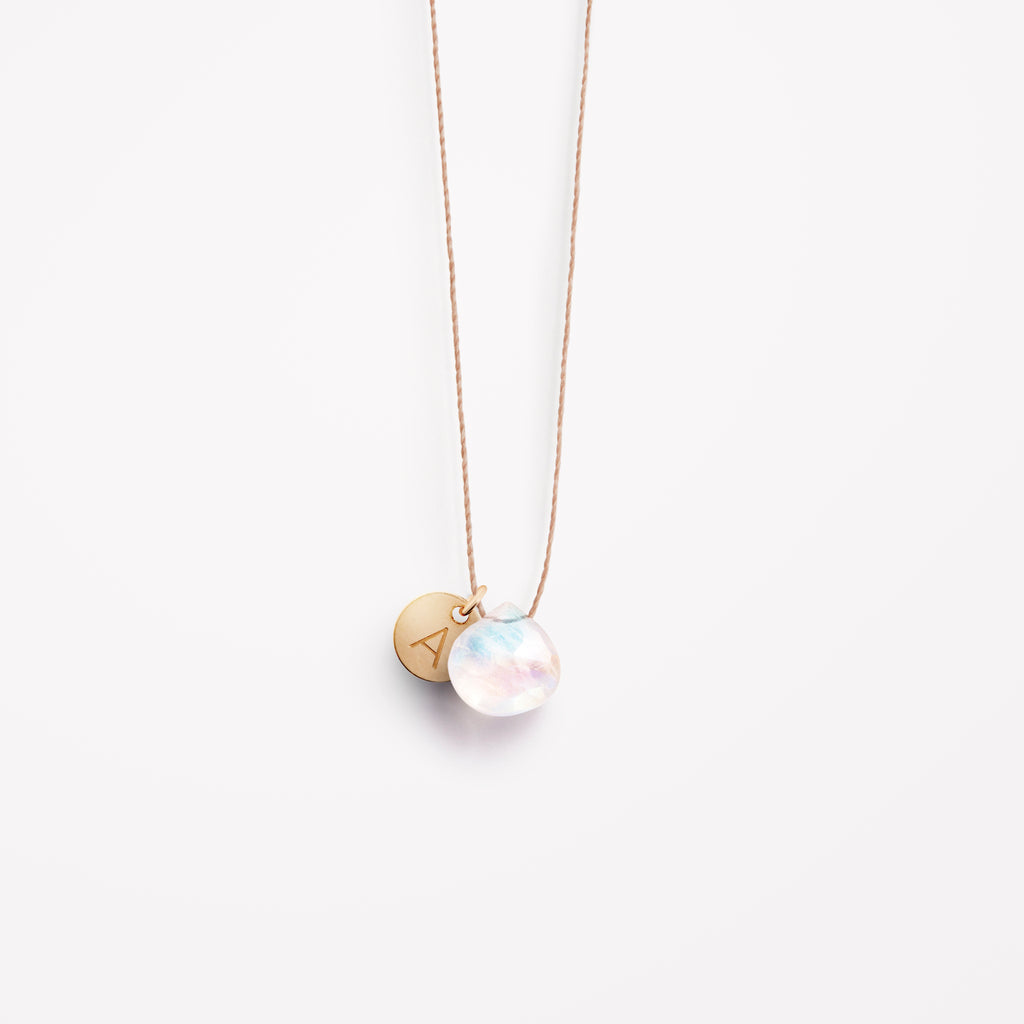 Wanderlust Life Ethically Handmade jewellery made in the UK. Minimalist gold and fine cord jewellery. Personalised june birthstone, rainbow moonstone fine cord necklace with 14k gold fill personalised tag.