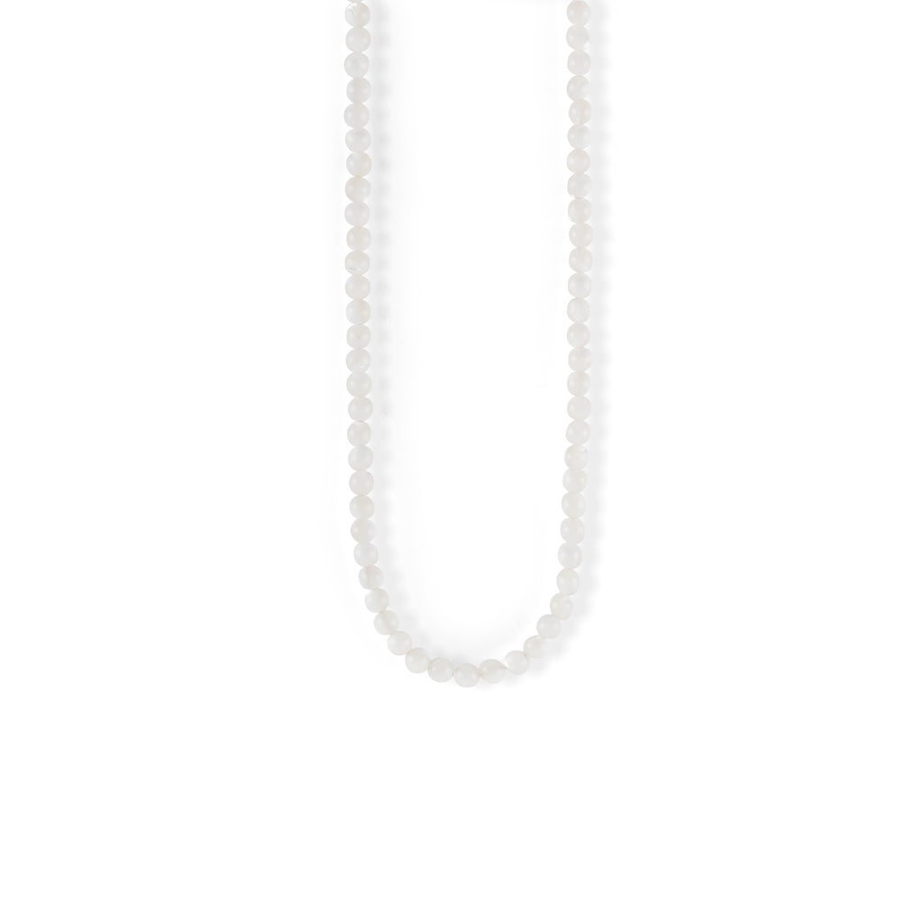 A monochrome beaded necklace borrows the essence of the sea. 
