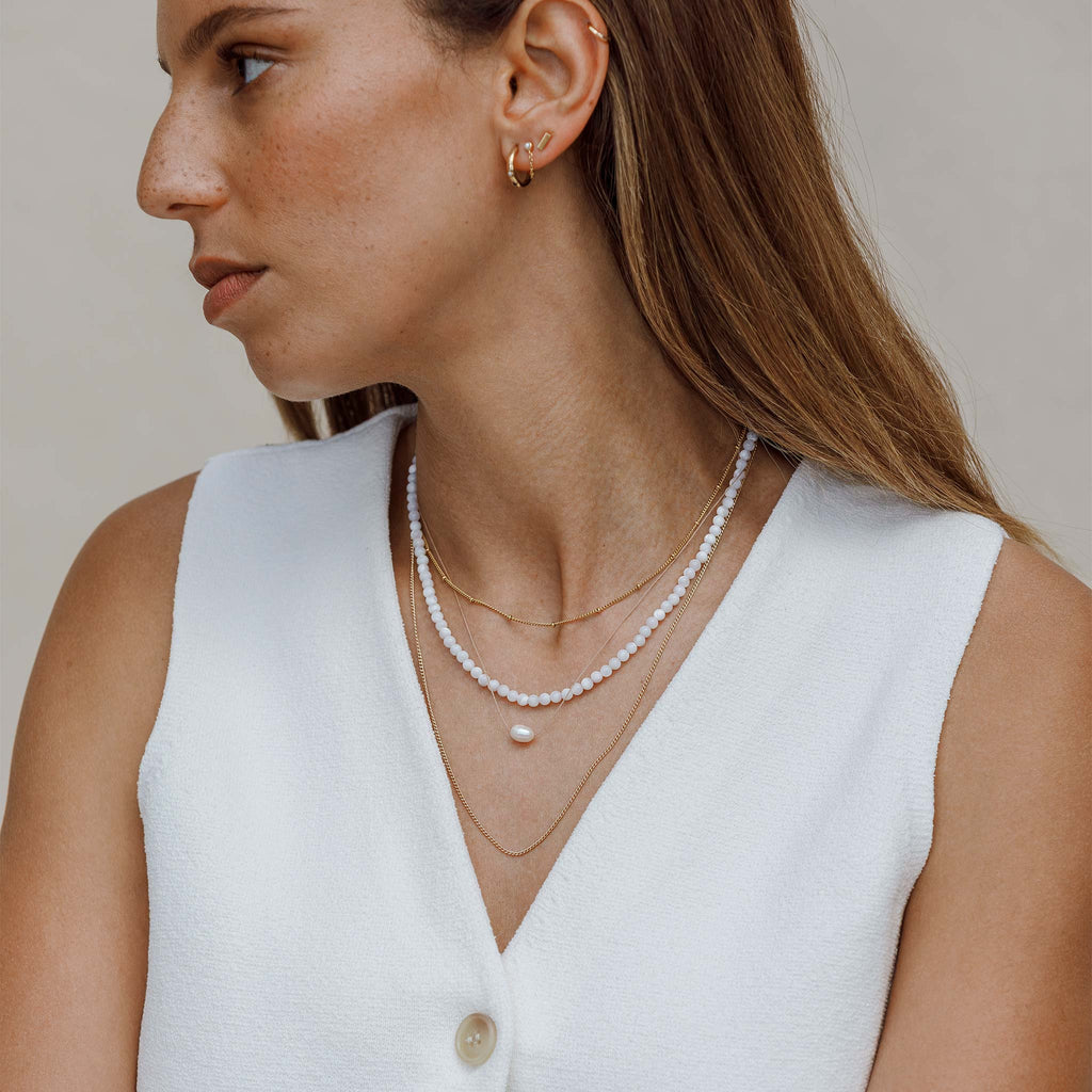 The gold fill Celine Necklace is a minimal, curb chain long necklace. The Celine chain is a necklace layering essential, and is effortlessly styled with gold and pearl jewellery.