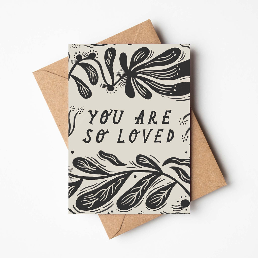 You are so loved affirmation greetings card, decorated with a contemporary, monochrome botanic illustration.