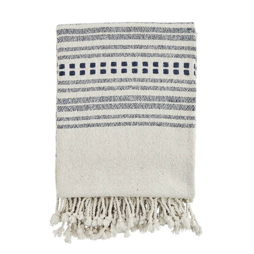 A beautiful patterned throw with decorative fringes at the sides. This throw is woven from cotton made from 100% recycled discarded clothing.